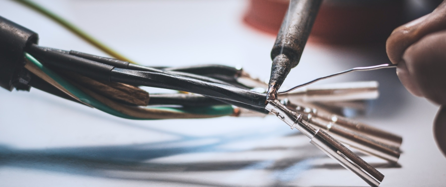electricians-are-using-soldering-iron-connect-wires-metal-pin-with-soldering-lead